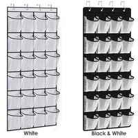 White hanging shoe organizer with 24 clear pockets displayed on the back of a door, holding various shoes.