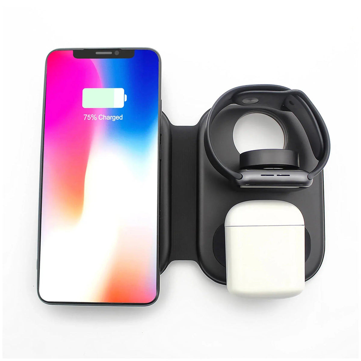 Close-up of wireless charging station charging an iPhone, Apple Watch, and earbuds simultaneously.