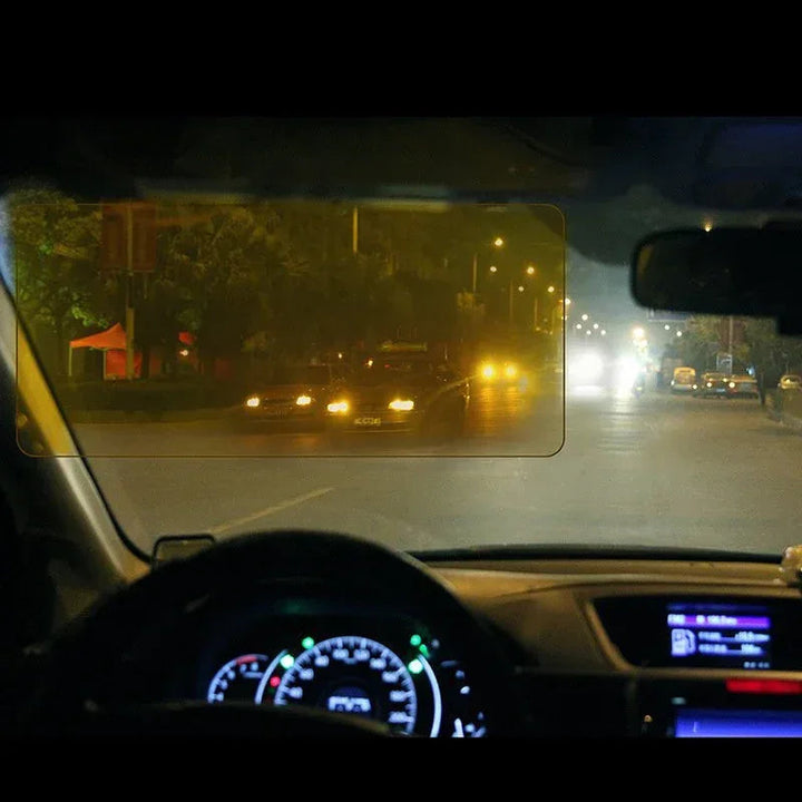 A car visor attachment filtering sunlight and headlight glare, improving driver visibility and comfort.