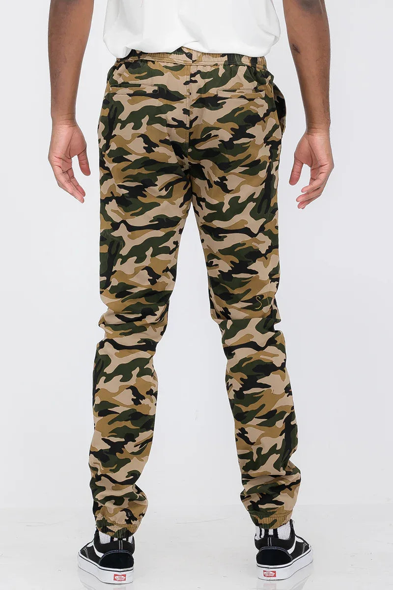 Full view of solid jogger pants highlighting tapered legs and comfortable fit.