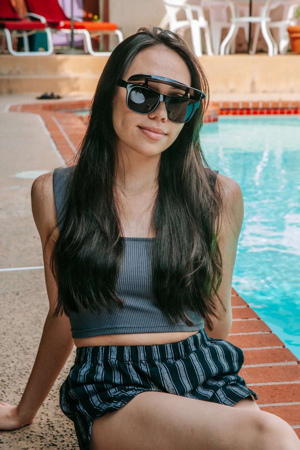 Flipside Sunglasses folded flat showing frame thickness and visor mechanism.