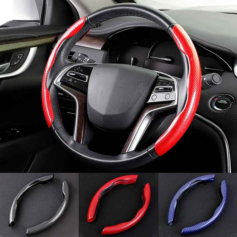 A pair of black carbon fiber-pattern steering wheel covers displayed on a dark surface.