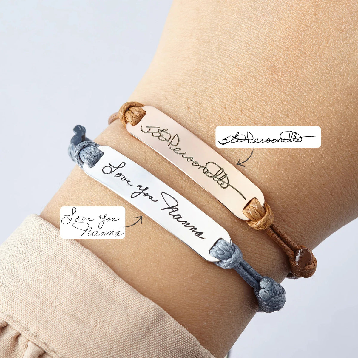 Handwriting bracelet shown on a wrist, engraved with a signature and message.
