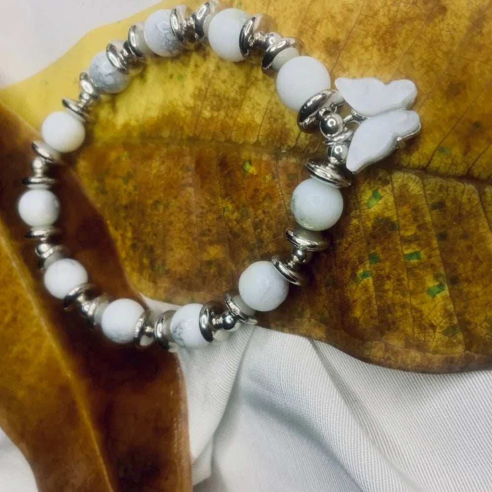 Stretch bracelet featuring spotted Dalmatian Jasper beads and shiny silver spacers