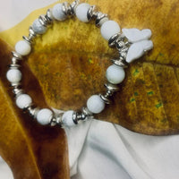 Stretch bracelet featuring spotted Dalmatian Jasper beads and shiny silver spacers