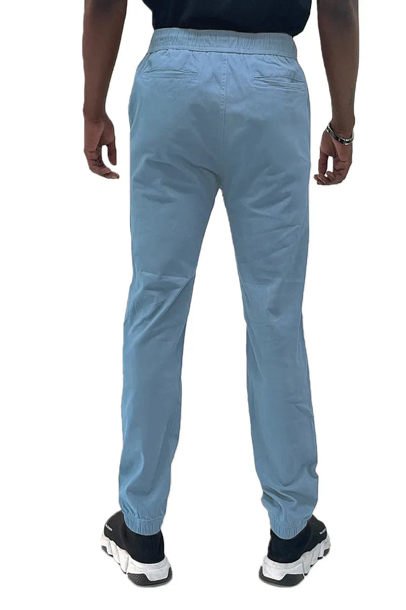 Close-up of jogger pants fabric texture highlighting cotton and elastane blend material.