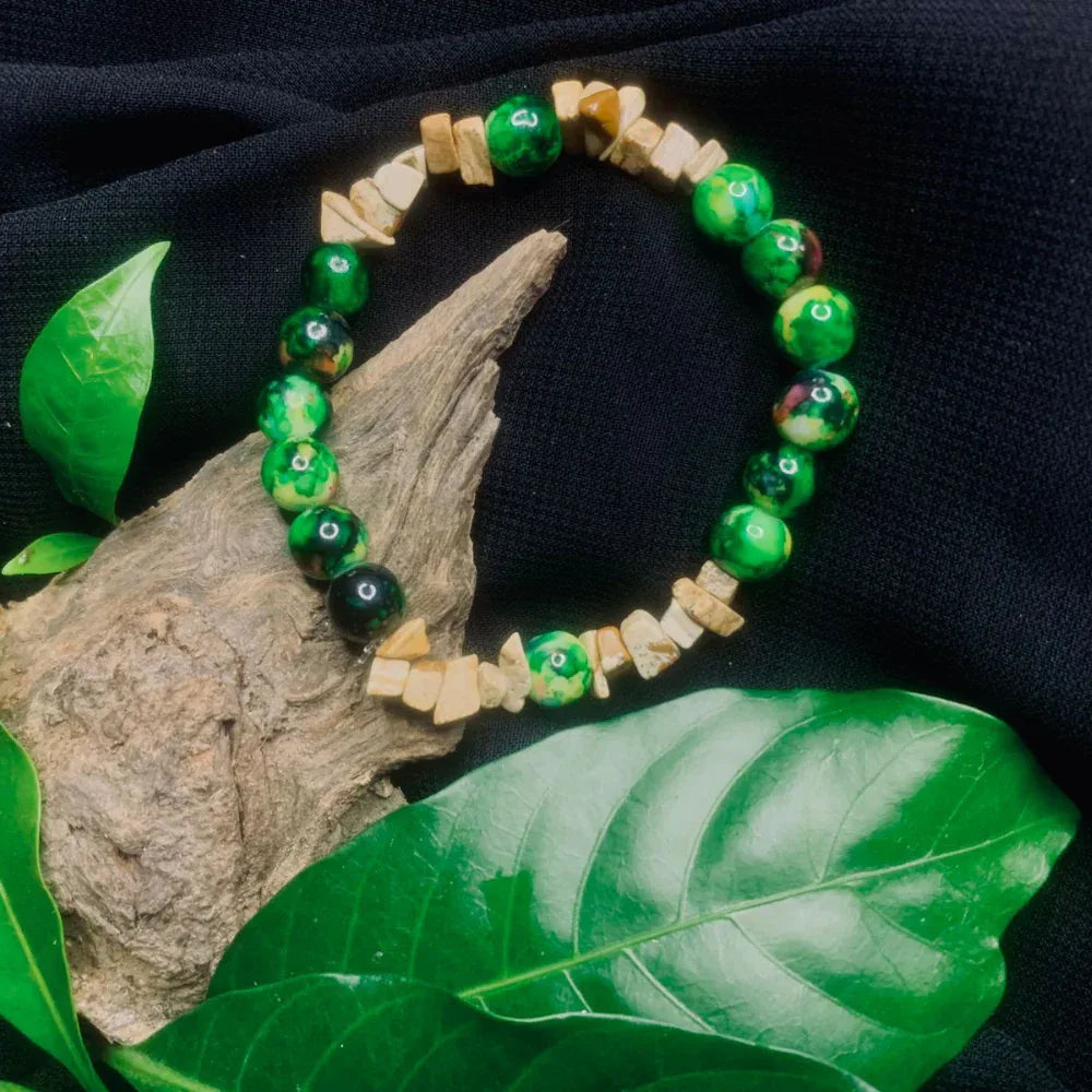 Close-up of Bark Agate and black-green stone chip stretch bracelet with natural textured beads.