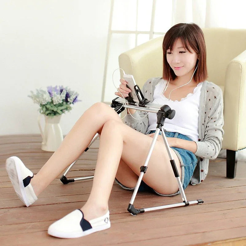 Bed holder holding a phone and tablet at an easy-to-read angle on a bed