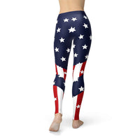 Back view of woman modeling full-length American flag leggings outdoors