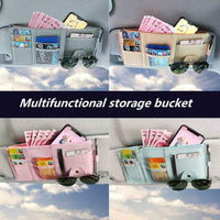 Installed black car sun visor organizer showing organized storage of small items inside vehicle