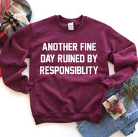 Hem of gray sweatshirt showing double-needle stitching and fabric texture
