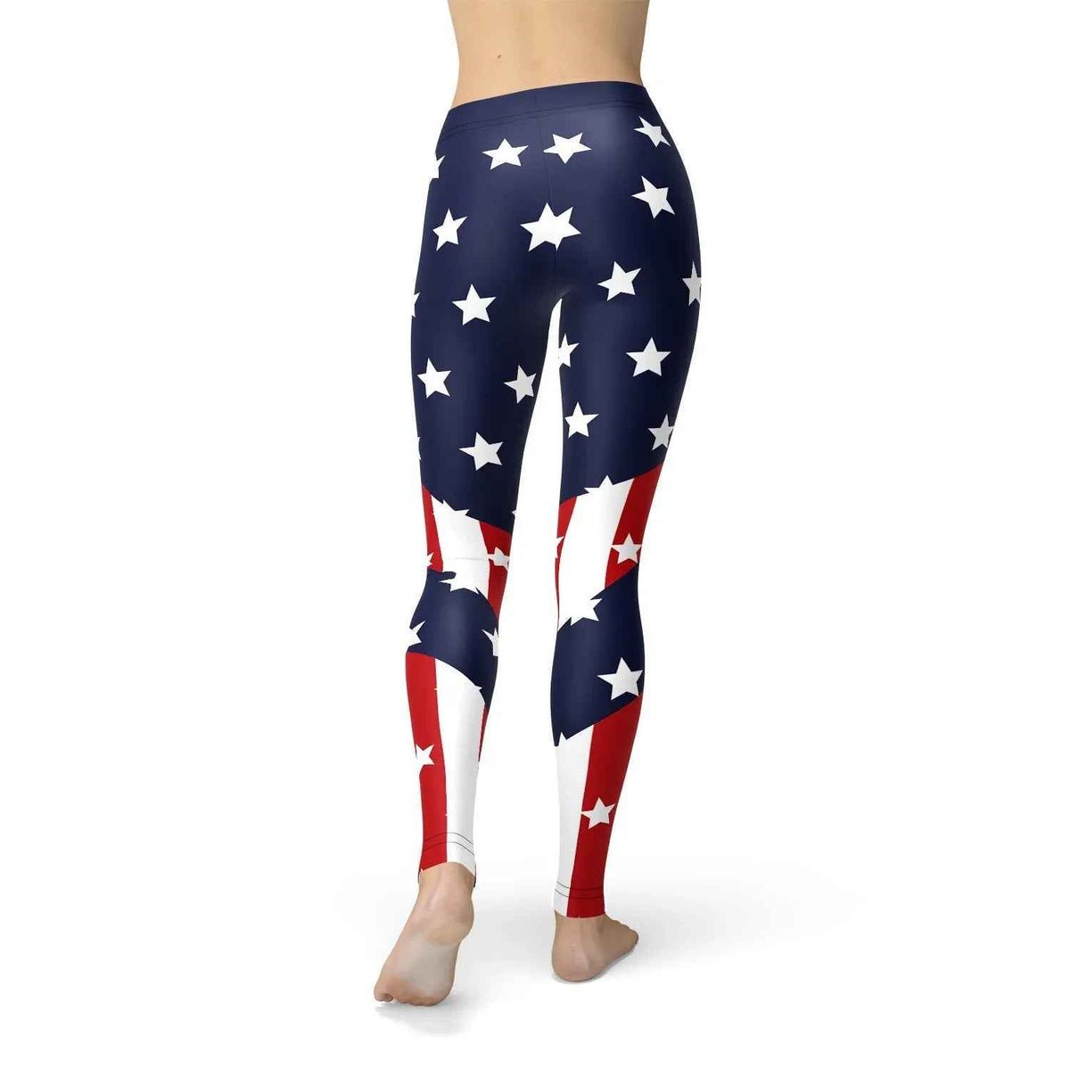 Back view of woman modeling full-length American flag leggings outdoors