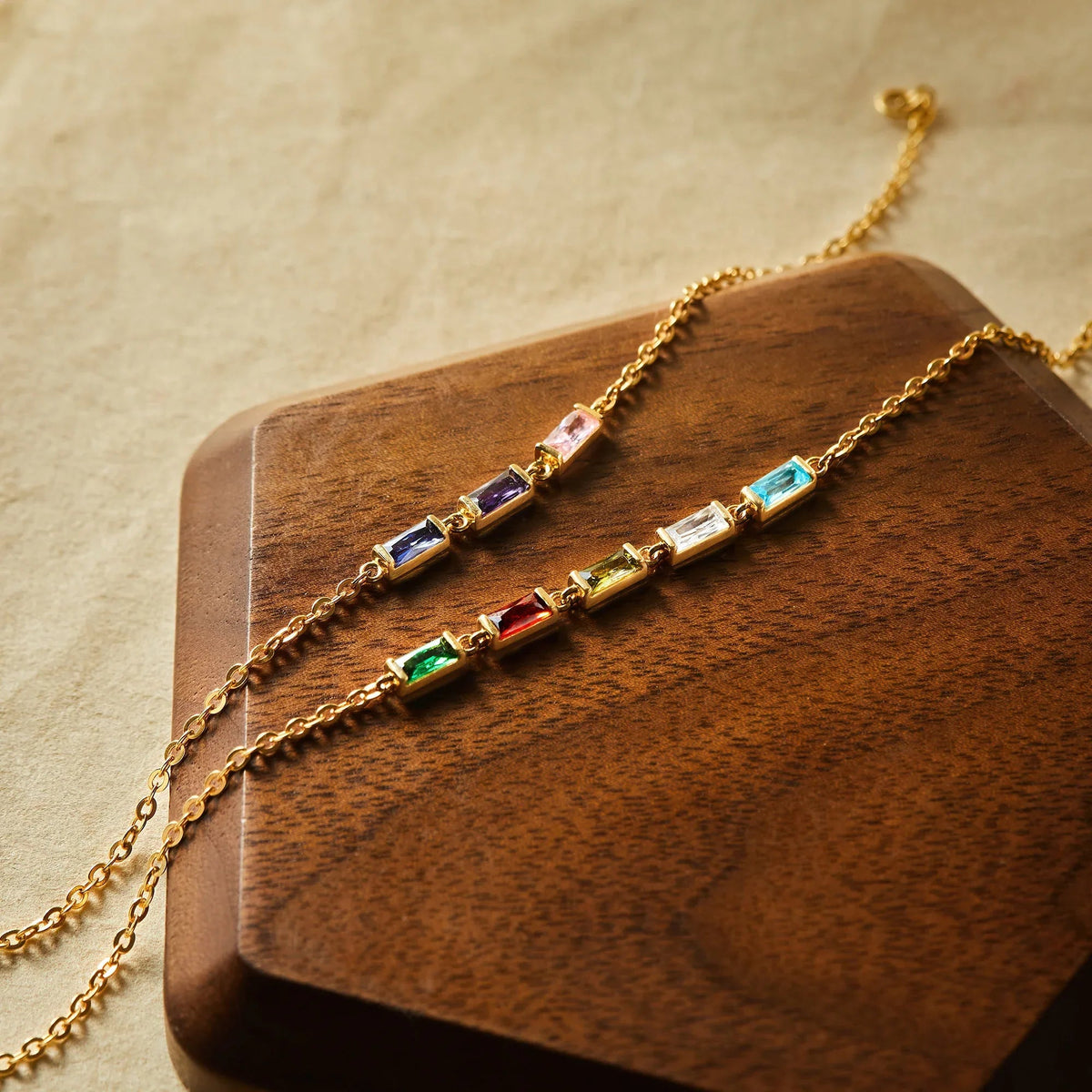 Elegant display of a birthstone mom bracelet with multicolored charms and delicate chain.