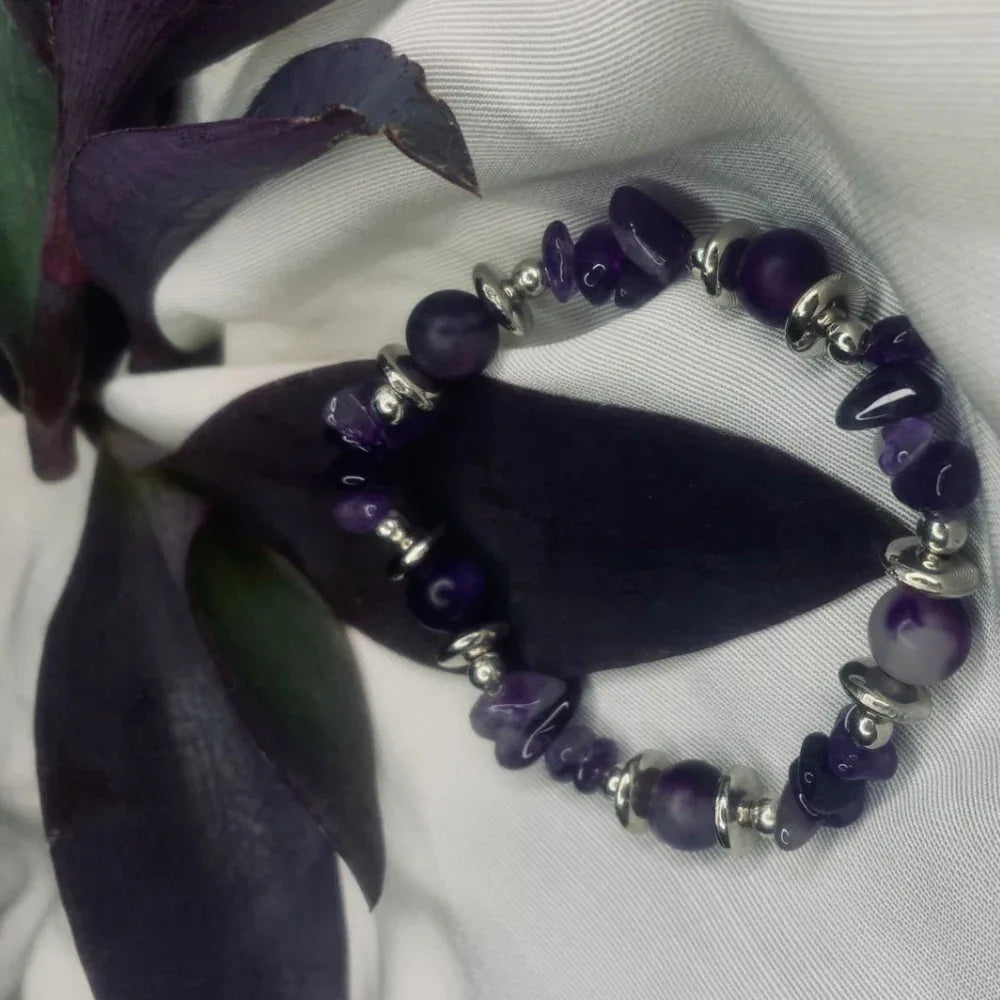 Purple agate chips and shiny silver spacers alternating on stretch bracelet