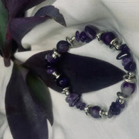 Purple agate chips and shiny silver spacers alternating on stretch bracelet
