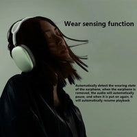 Wireless Bluetooth headphones displayed with charging case and cables on white background.