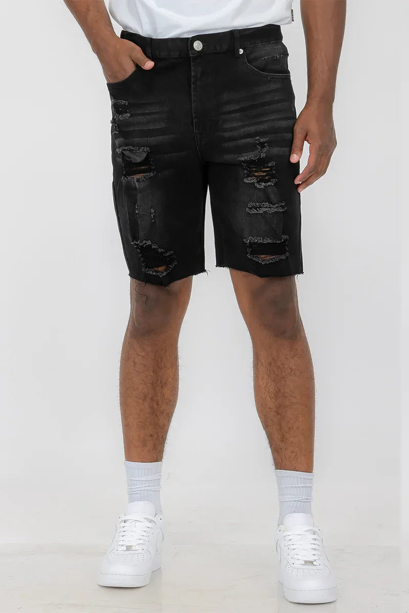 Front view of men's distressed denim shorts above the knee, size 34, worn by male model.