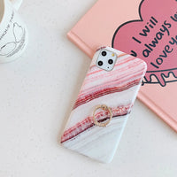 Side view of marble iPhone case showing soft raised edges for screen protection.
