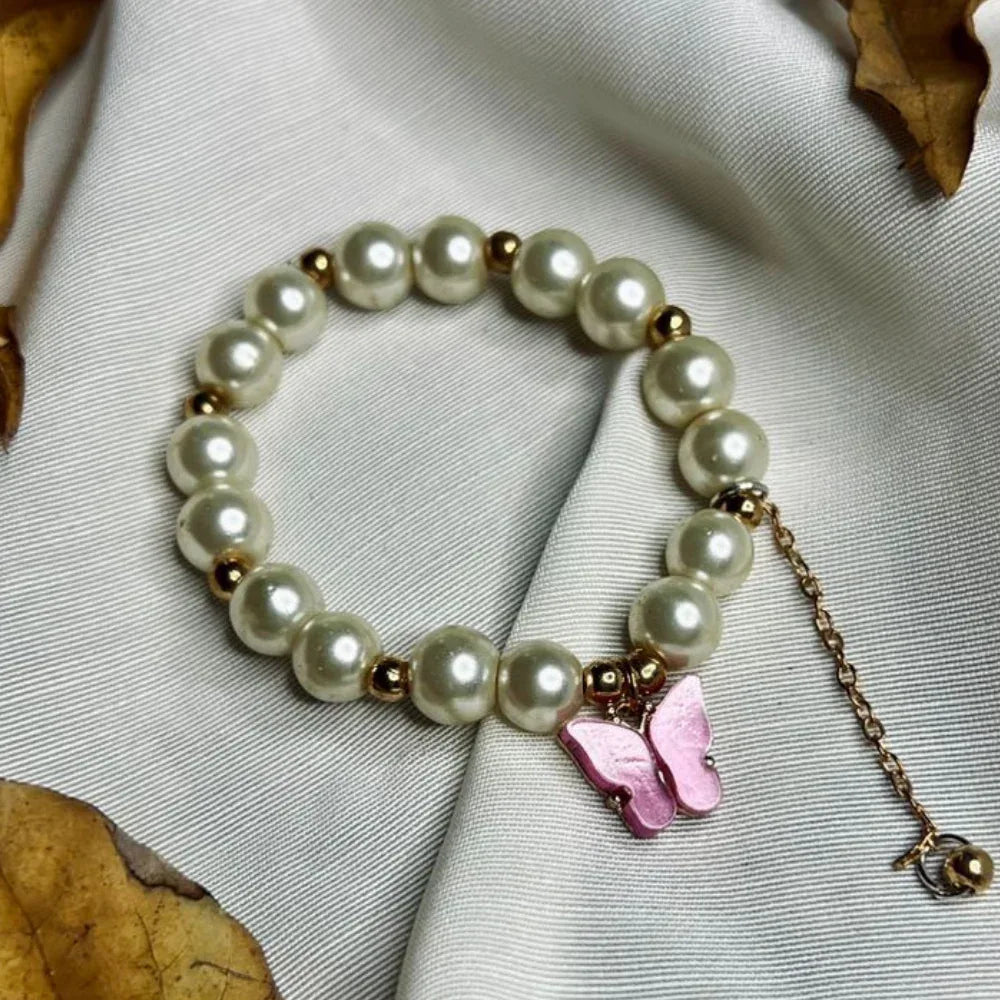 Faux pearl beaded bracelet with purple butterfly pendant, elegant and feminine design for girls