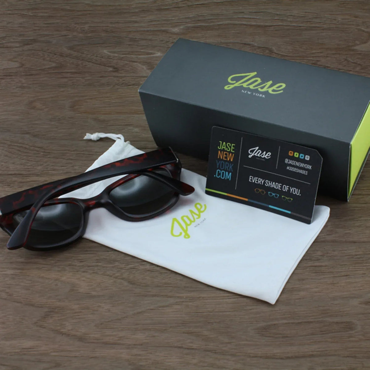 Front view of Jase New York Delano matte black frame sunglasses on a white surface.