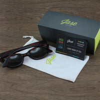 Front view of Jase New York Delano matte black frame sunglasses on a white surface.