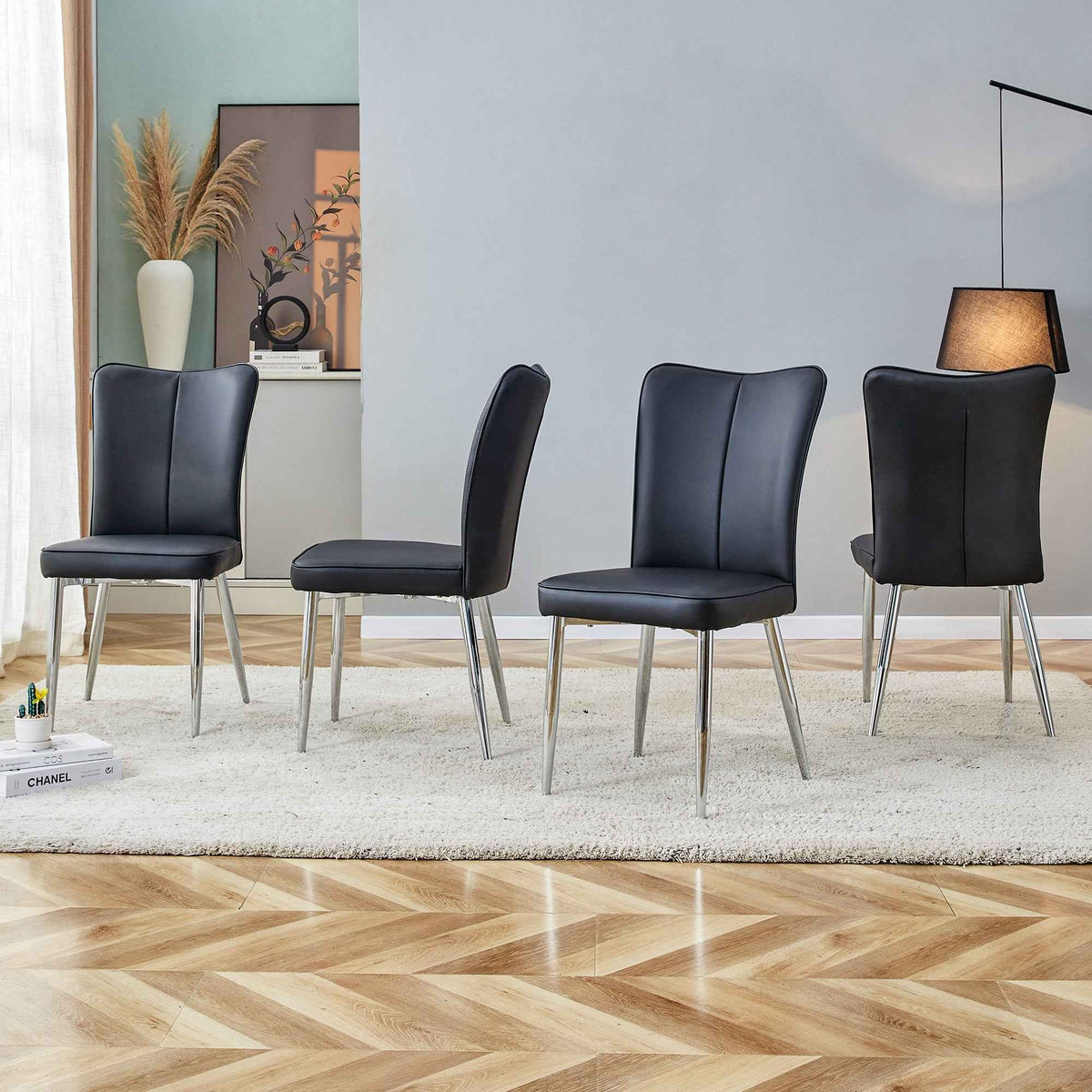 Modern black dining chair with ergonomic curved backrest and metal legs on white background