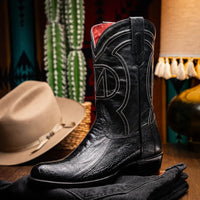 Side profile of Denver Black ostrich leg skin boot highlighting red stitching and pull tabs.