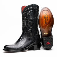 Close-up of Denver Black ostrich leg skin cowboy boot showing detailed leather texture and red vamp.