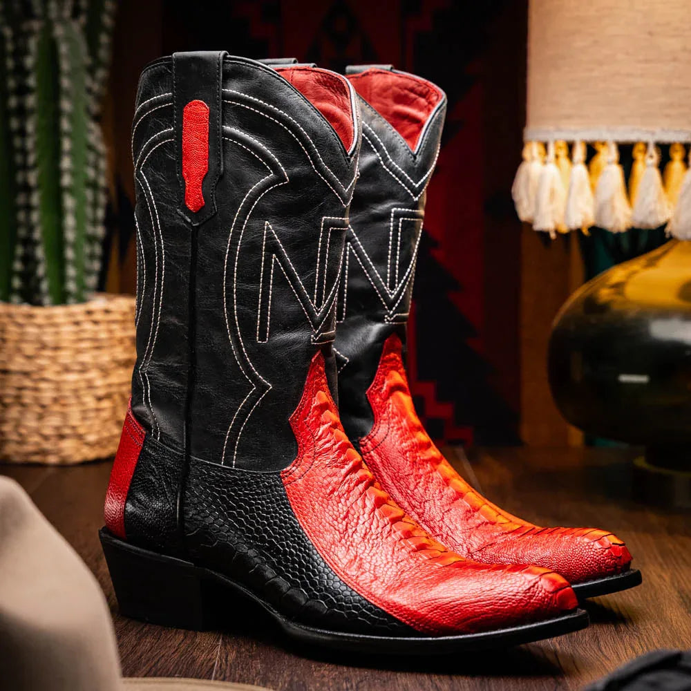 Side view of Denver red and black ostrich leather boot on wooden floor.