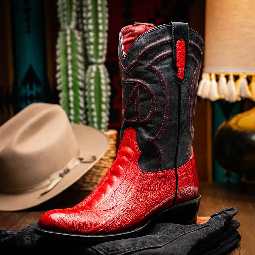 Side view of Denver Red boot highlighting black shaft, red pull tabs, and intricate stitching.