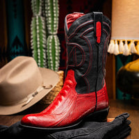 Side view of Denver Red boot highlighting black shaft, red pull tabs, and intricate stitching.