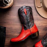 Denver Red boots worn outdoors, emphasizing contrast between red vamp and black full-grain leather.