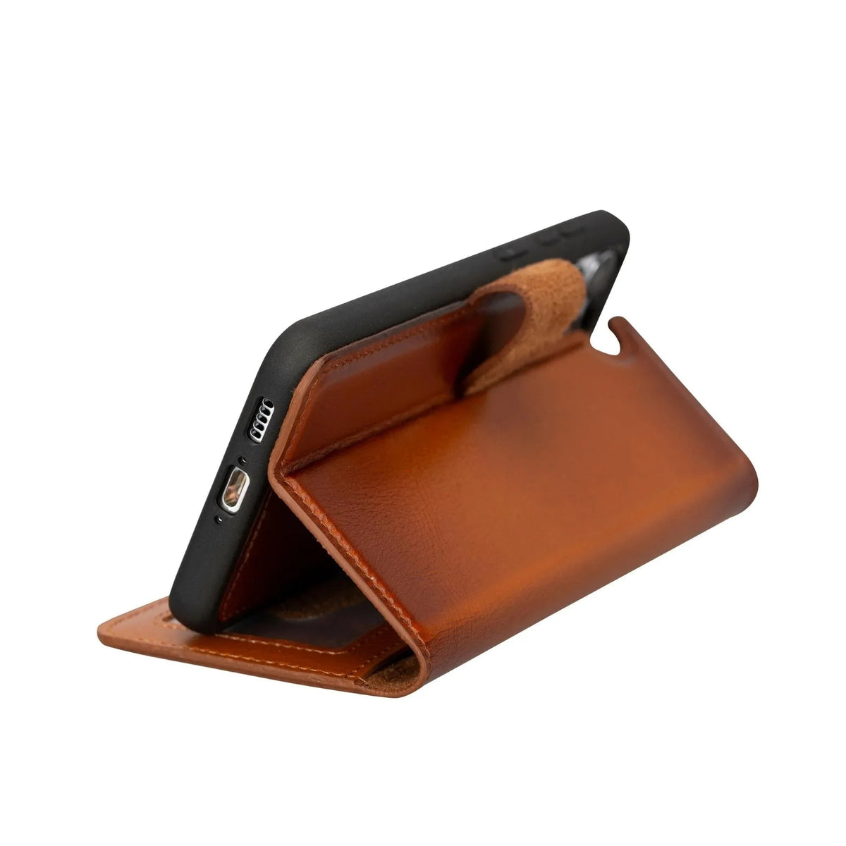 Close-up of the strong magnet securing the detachable leather wallet case closed