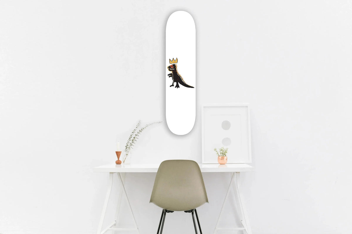 White desk with dinosaur skateboard propped vertically, bright room background