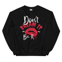 Black fleece sweatshirt with 'Don't Dream It' printed in white, featuring adjustable cuffs.
