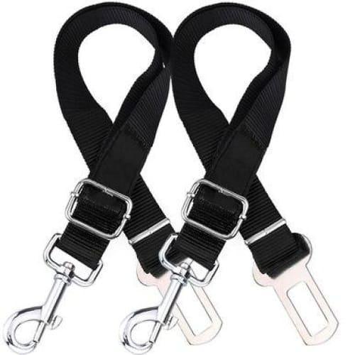 Two adjustable black dog seatbelt connectors attached to car seats, designed to safely restrain pets during travel.