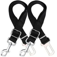 Two black adjustable dog seatbelt connectors with metal clips attached, designed for safe car travel with pets.