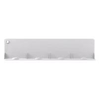 Top view of flexible silicone water baffle covering kitchen sink drain to prevent splashing.