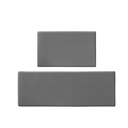 Two kitchen mats arranged neatly near stove and counter in a bright kitchen.