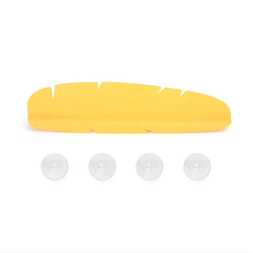 White silicone sink splash guard with curved design shown on kitchen sink edge.