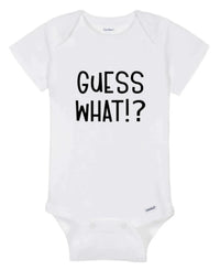 Close-up of white baby onesie fabric showing colorful 'Guess What!? Chicken Butt' print.