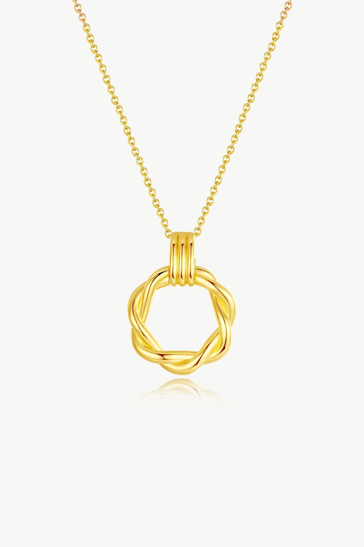 Close-up of Eléa Gold Twisted Hoop Pendant Necklace showing intricate twisted design against neutral background.