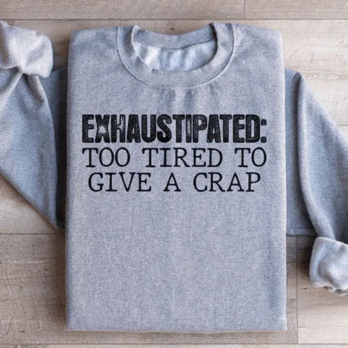Sport grey sweatshirt showcasing peach text saying Exhaustipated To Tired To Give A Crap on the chest.