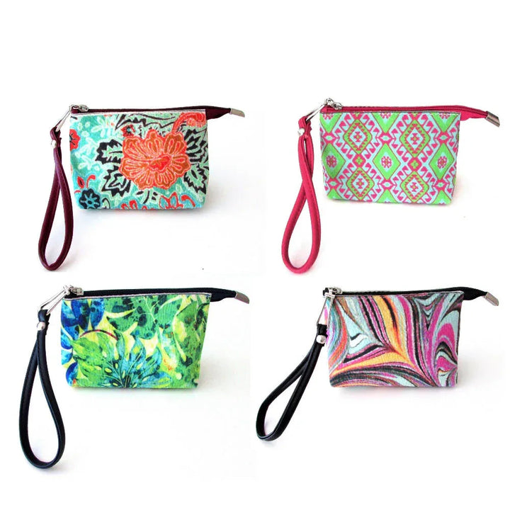 Red pomegranate patterned wristlet bag with wrist strap, standing upright on white background.