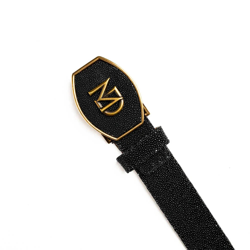 Black stingray belt laid flat highlighting diamond eye centerpiece detail