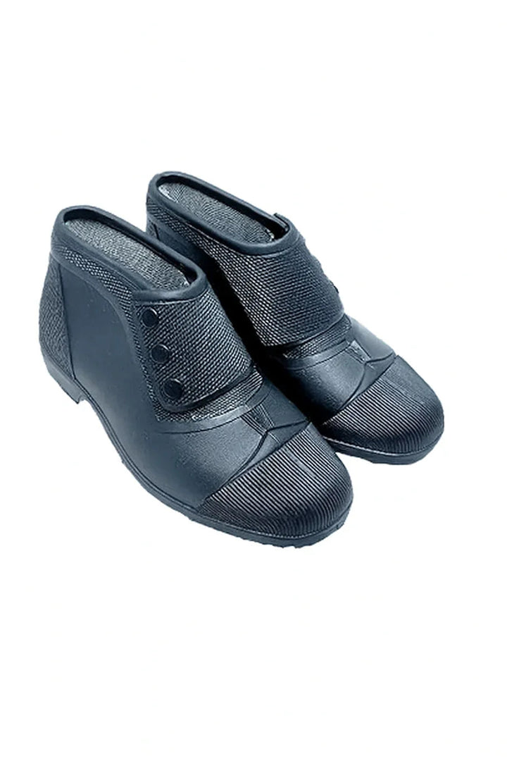 Black slip-on rubber safety shoes with anti-slip sole designed for fire protection and industrial use