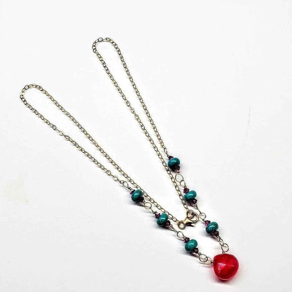 Turquoise magnesite and fuchsia chalcedony gemstones on 14K gold-filled drop necklace.
