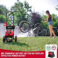 Pressure washer with battery removed sitting on ground, showing battery compartment