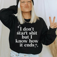 Black fleece sweatshirt with white text I Know How It Ends, small size, cozy fabric.
