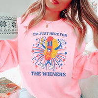 Light pink t-shirt featuring bold white text reading 'I’m Just Here For The Wieners'.